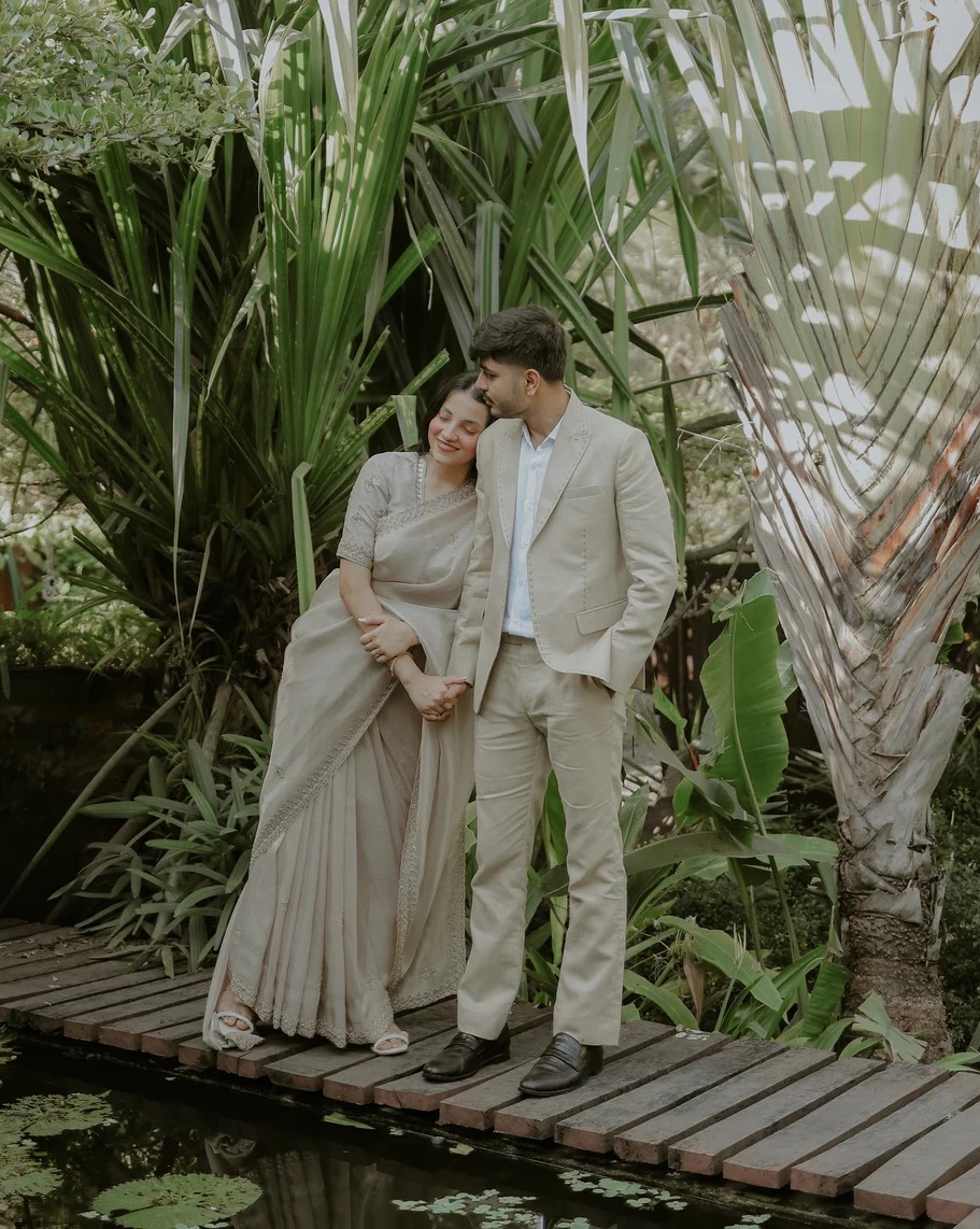Romantic couple portrait in lush green foliage