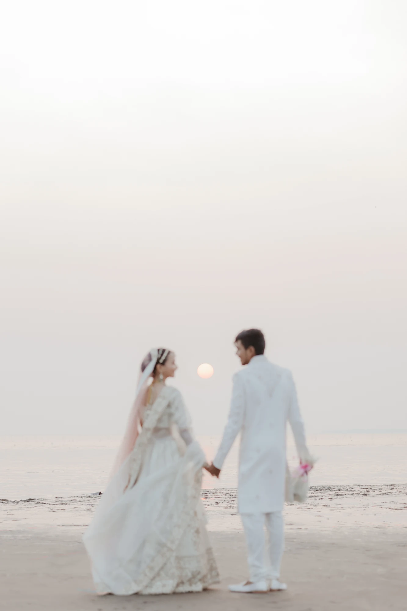 Couple walking into misty light