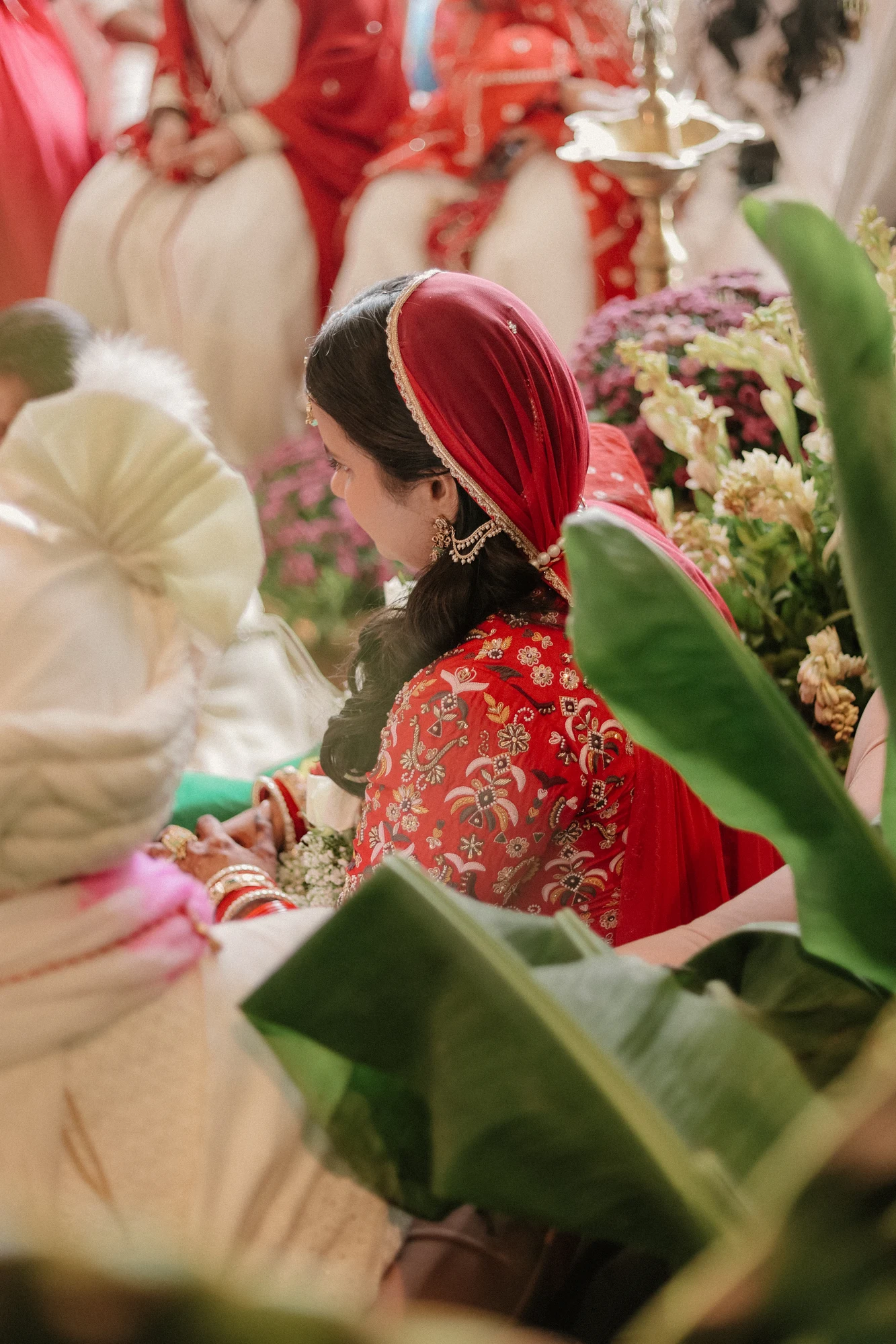 Bride framed by lush tropical leaves
