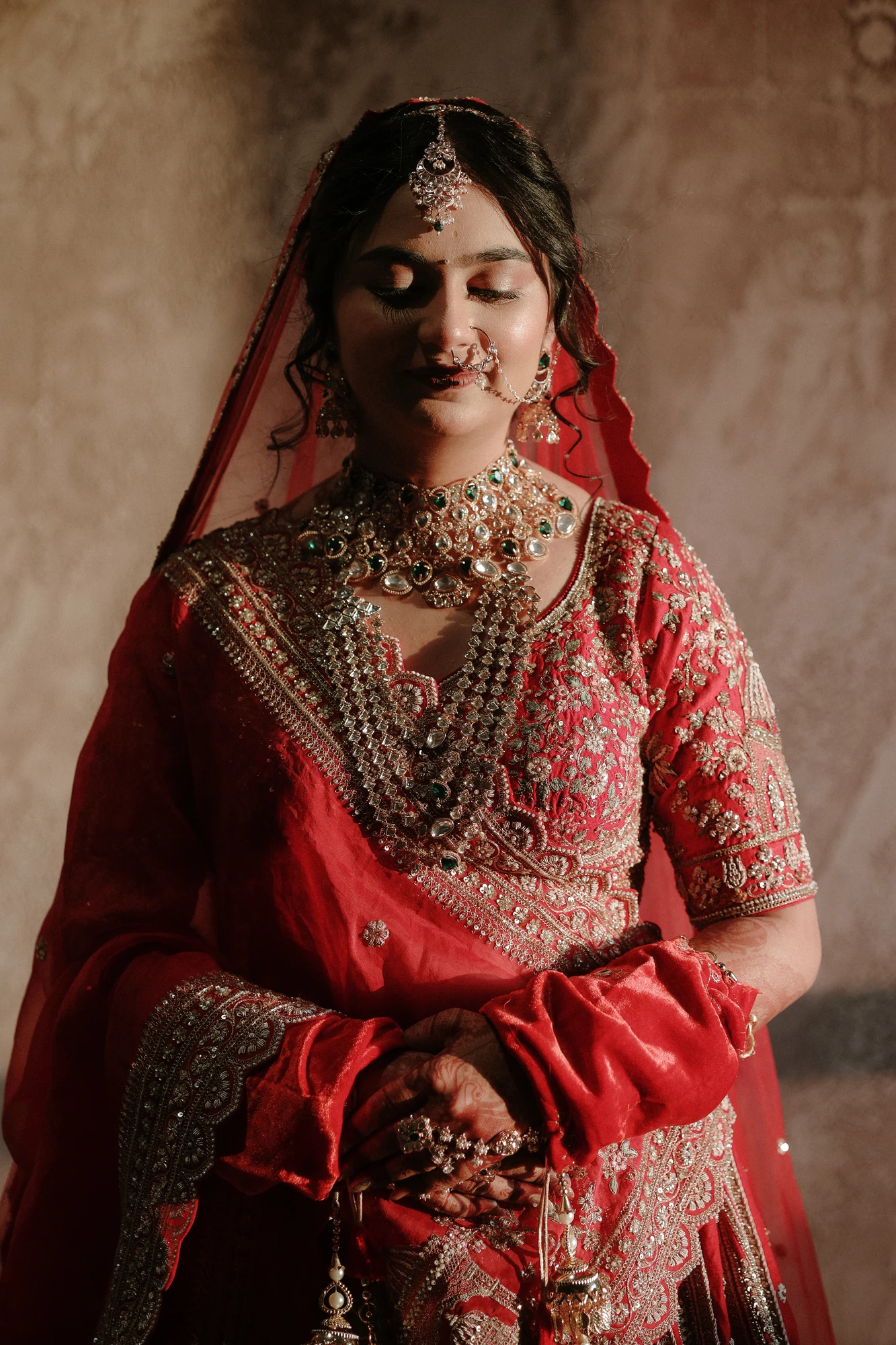 Regal bride portrait in red lehenga