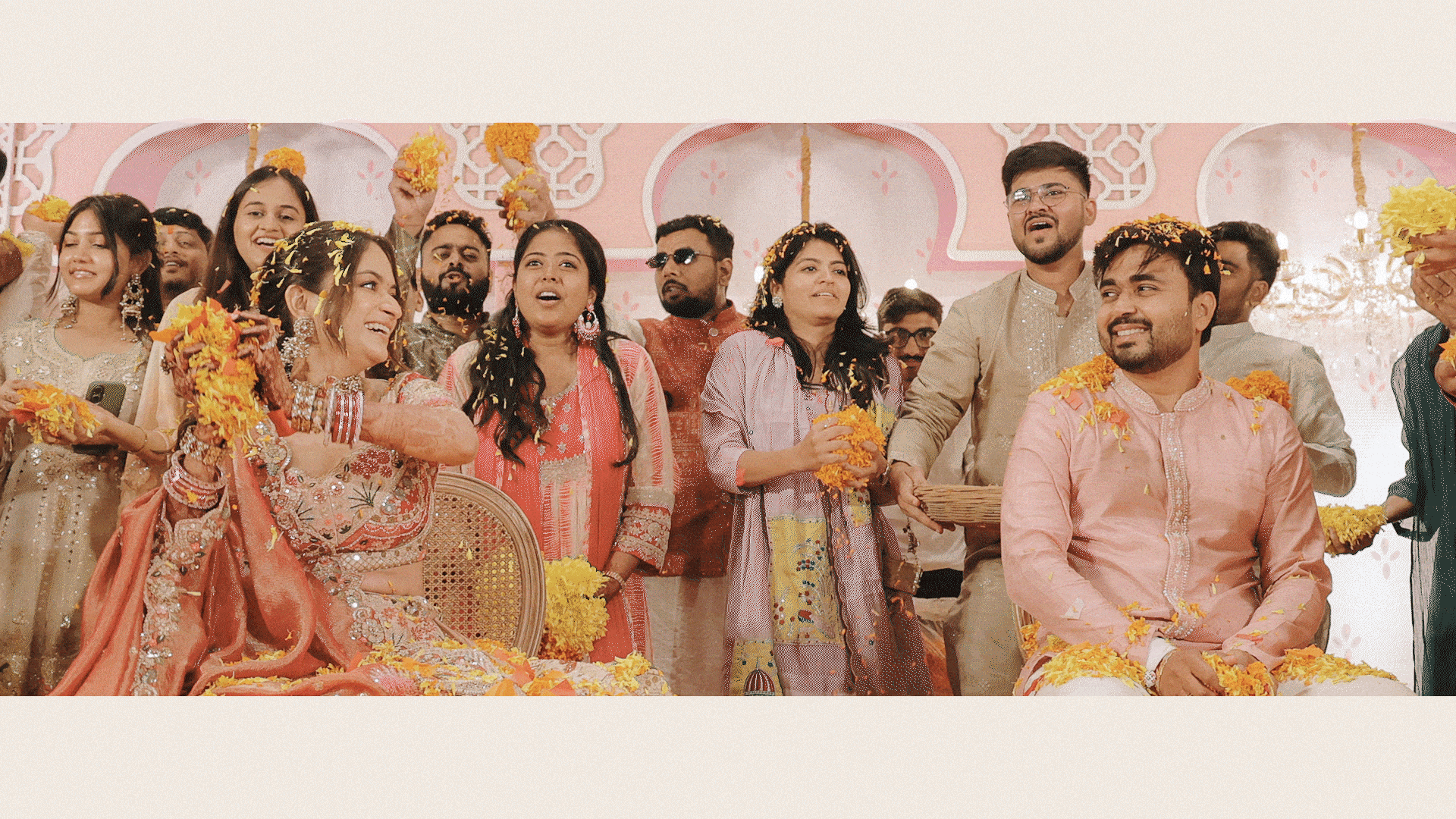 Joyful wedding celebration showered in yellow marigold flowers